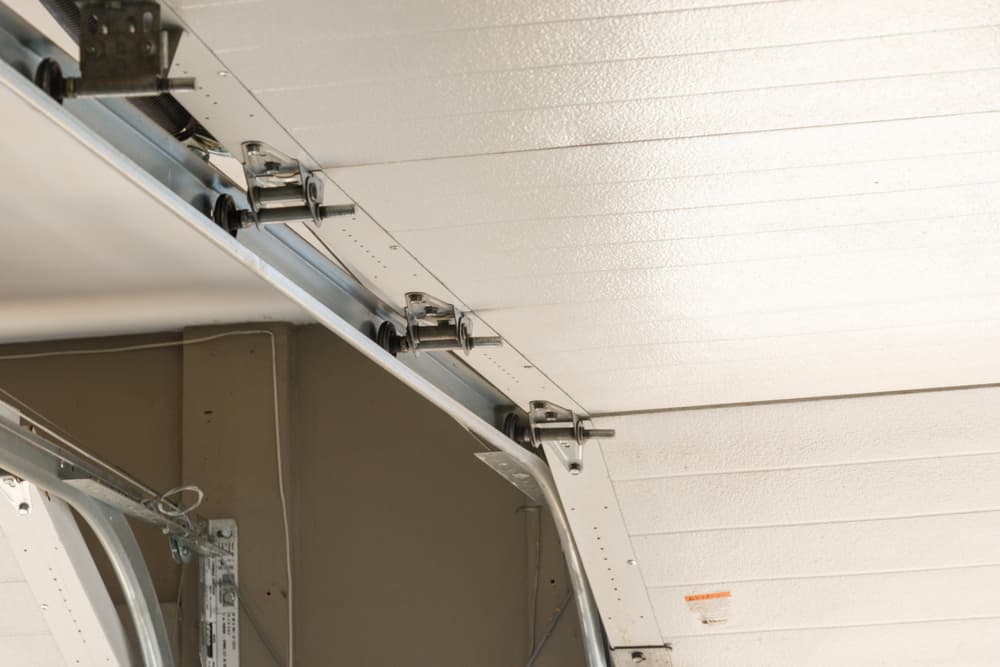 Garage door track, roller and cable repair for a Calgary home